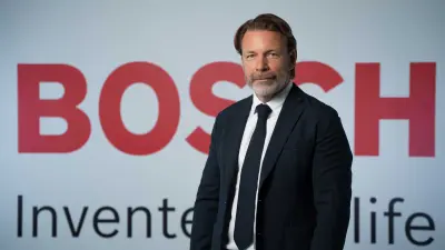 Per Johansson in front of a grey background with the slogan "Bosch Invented for life" 